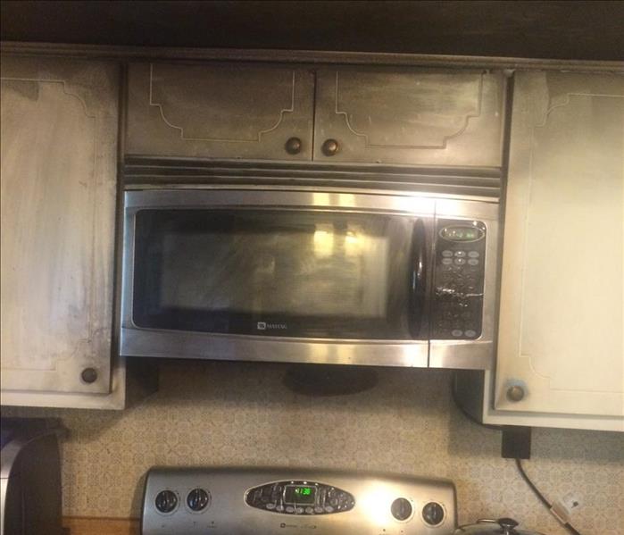 A fire damaged kitchen stove and range